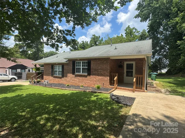 a view of a house with a yard porch and sitting area