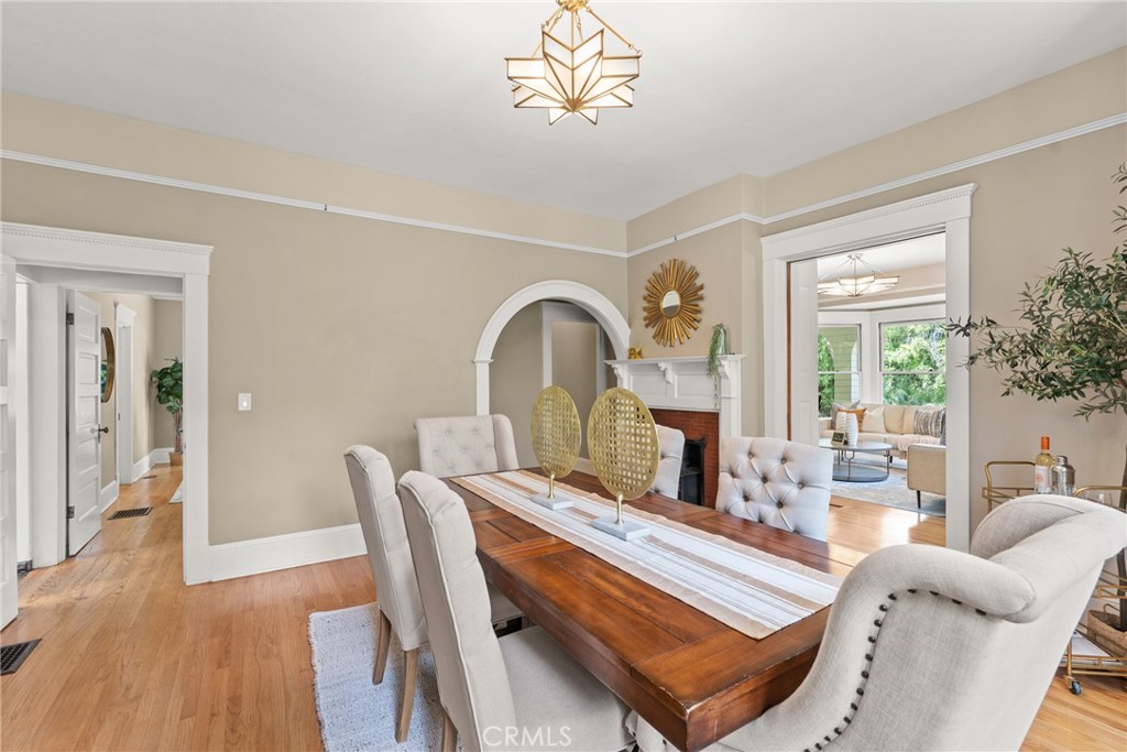 16 Campbell Avenue Redlands, CA 92373 - Photo 14 of 57 a view of a dining room with furniture a chandelier and wooden floor