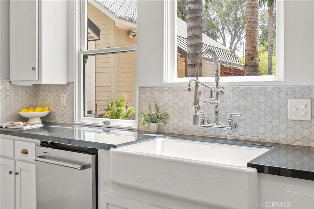 16 Campbell Avenue Redlands, CA 92373 - Photo 24 of 57 a bathroom with a sink and a bathtub next to a window