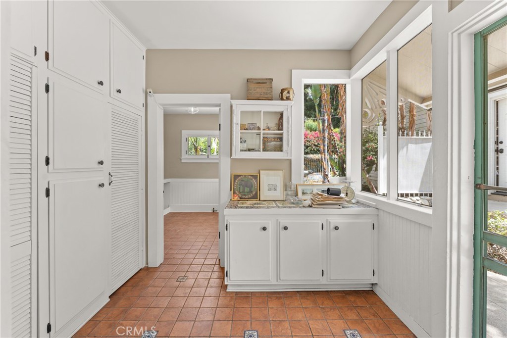 16 Campbell Avenue Redlands, CA 92373 - Photo 25 of 57 a view of cabinets with wooden floor and windows