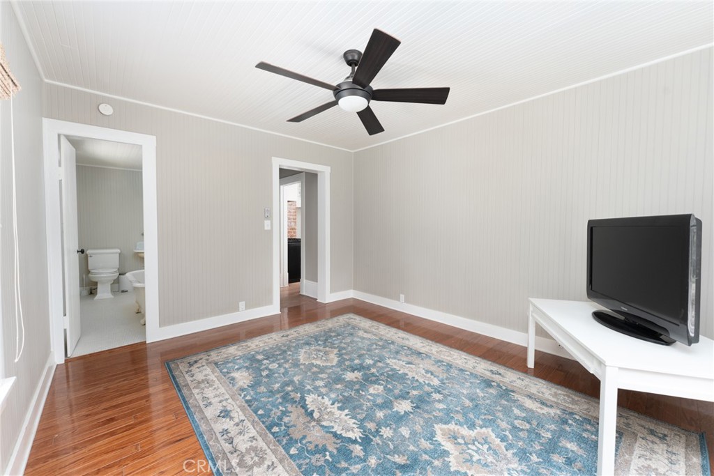 16 Campbell Avenue Redlands, CA 92373 - Photo 29 of 57 a view of a livingroom with wooden floor and a ceiling fan