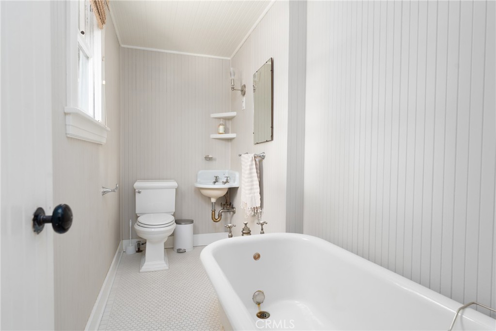 16 Campbell Avenue Redlands, CA 92373 - Photo 30 of 57 a bathroom with a bathtub and a toilet