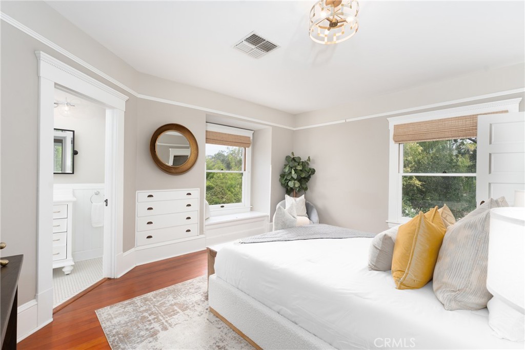 16 Campbell Avenue Redlands, CA 92373 - Photo 32 of 57 a bedroom with a bed mirror and window