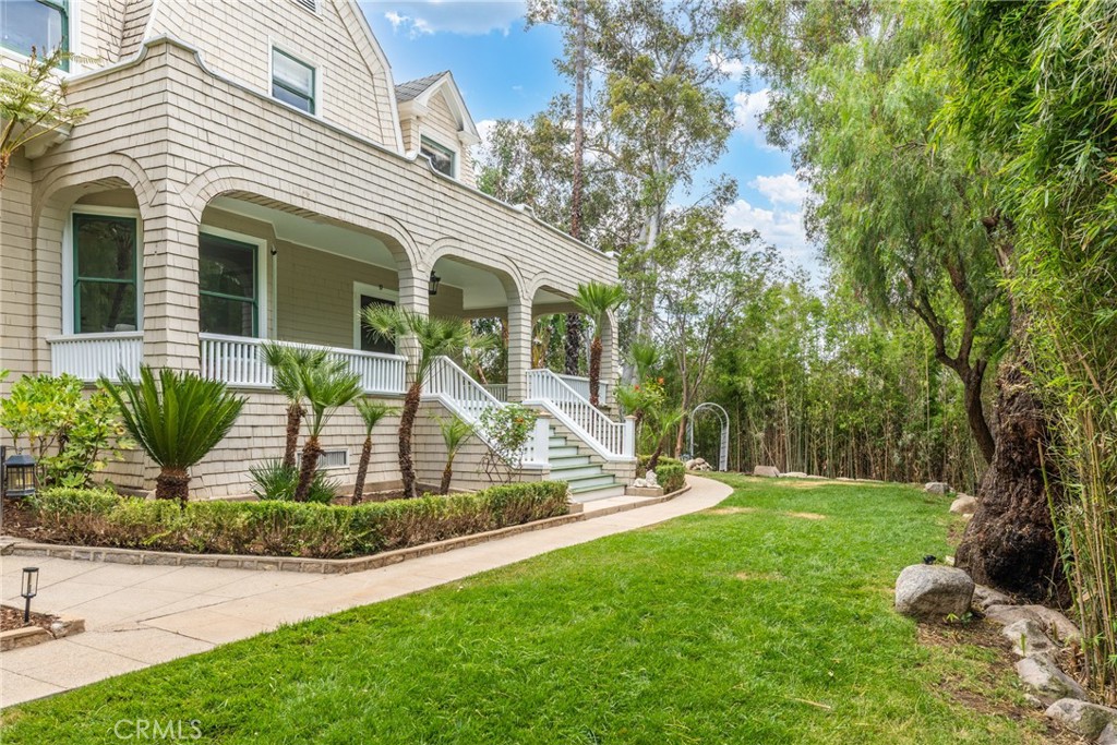16 Campbell Avenue Redlands, CA 92373 - Photo 4 of 57 a view of a house with backyard and a tree