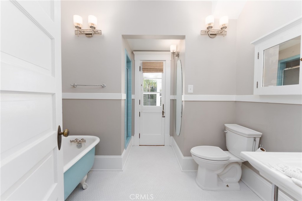 16 Campbell Avenue Redlands, CA 92373 - Photo 43 of 57 a white toilet sitting next to a bathroom sink