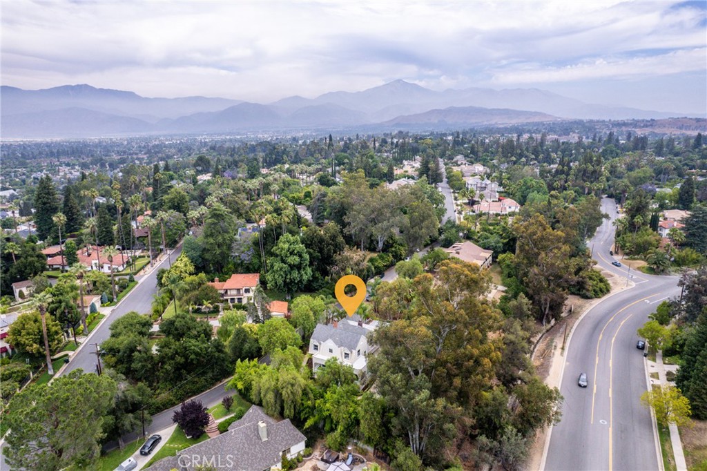 16 Campbell Avenue Redlands, CA 92373 - Photo 57 of 57 an aerial view of a city with lots of residential buildings and mountain view in back