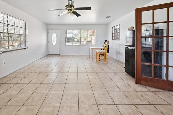 a view of a livingroom with furniture and windows