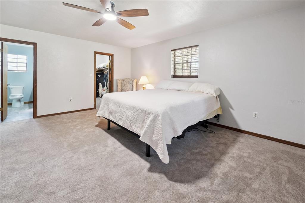 5098 Southwest 47th Loop Lake Butler, FL 32054 - Photo 18 of 34 a spacious bedroom with a bed and window