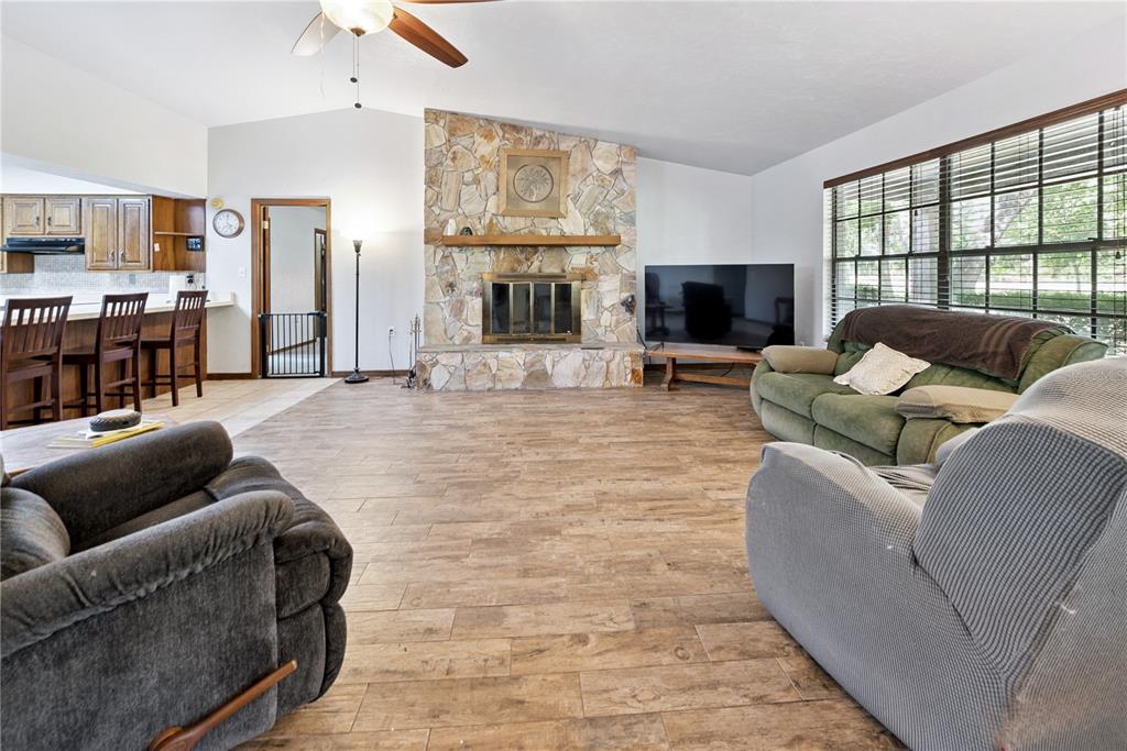 5098 Southwest 47th Loop Lake Butler, FL 32054 - Photo 7 of 34 a living room with furniture and a flat screen tv