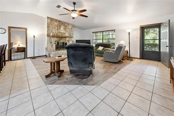 a living room with lots of furniture and a window