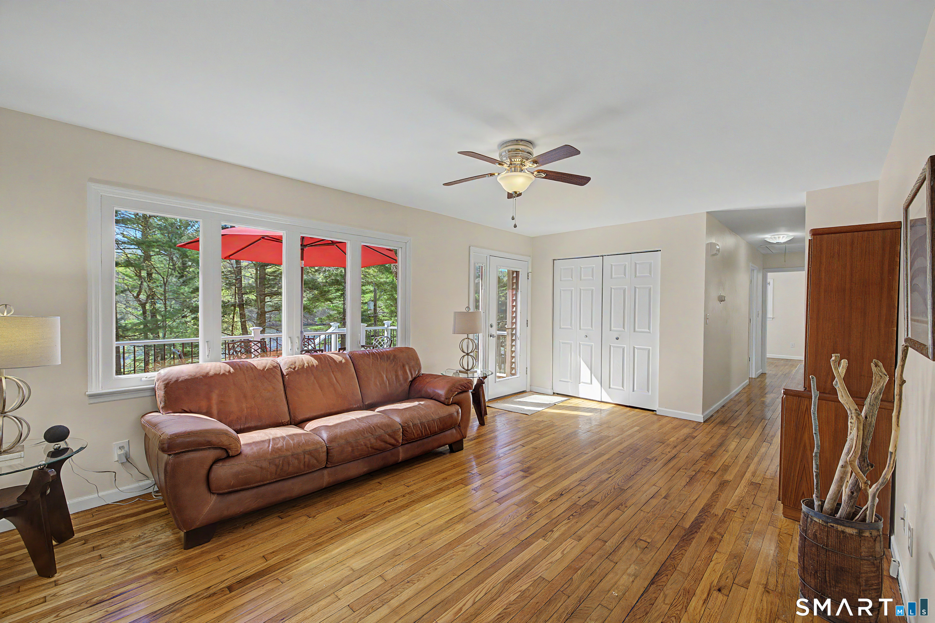 11 Candlewood Springs Road New Milford, CT 06776 - Photo 11 of 35 a living room with furniture and a large window