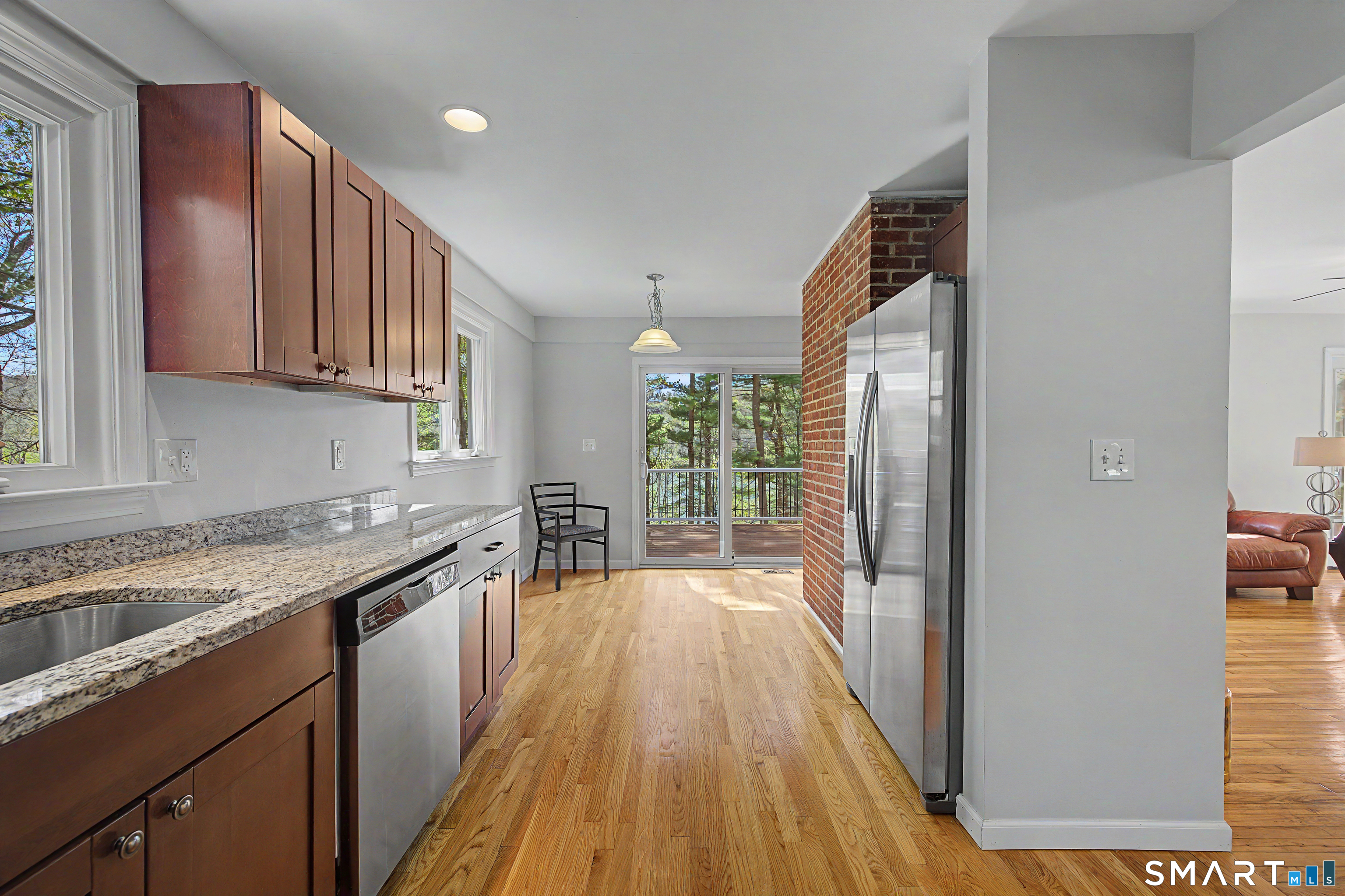 11 Candlewood Springs Road New Milford, CT 06776 - Photo 15 of 35 a kitchen with a sink and wooden cabinets