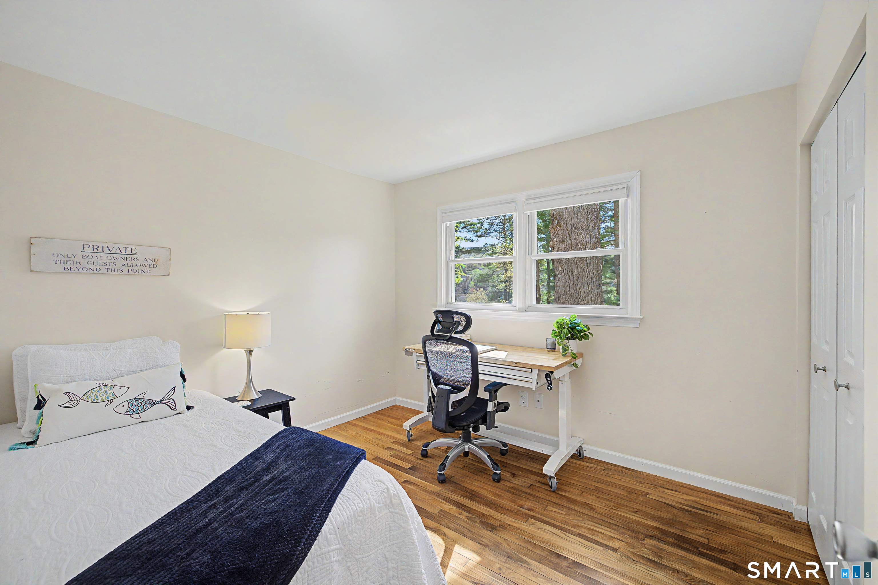 11 Candlewood Springs Road New Milford, CT 06776 - Photo 18 of 35 a room that has a bed and a table in it
