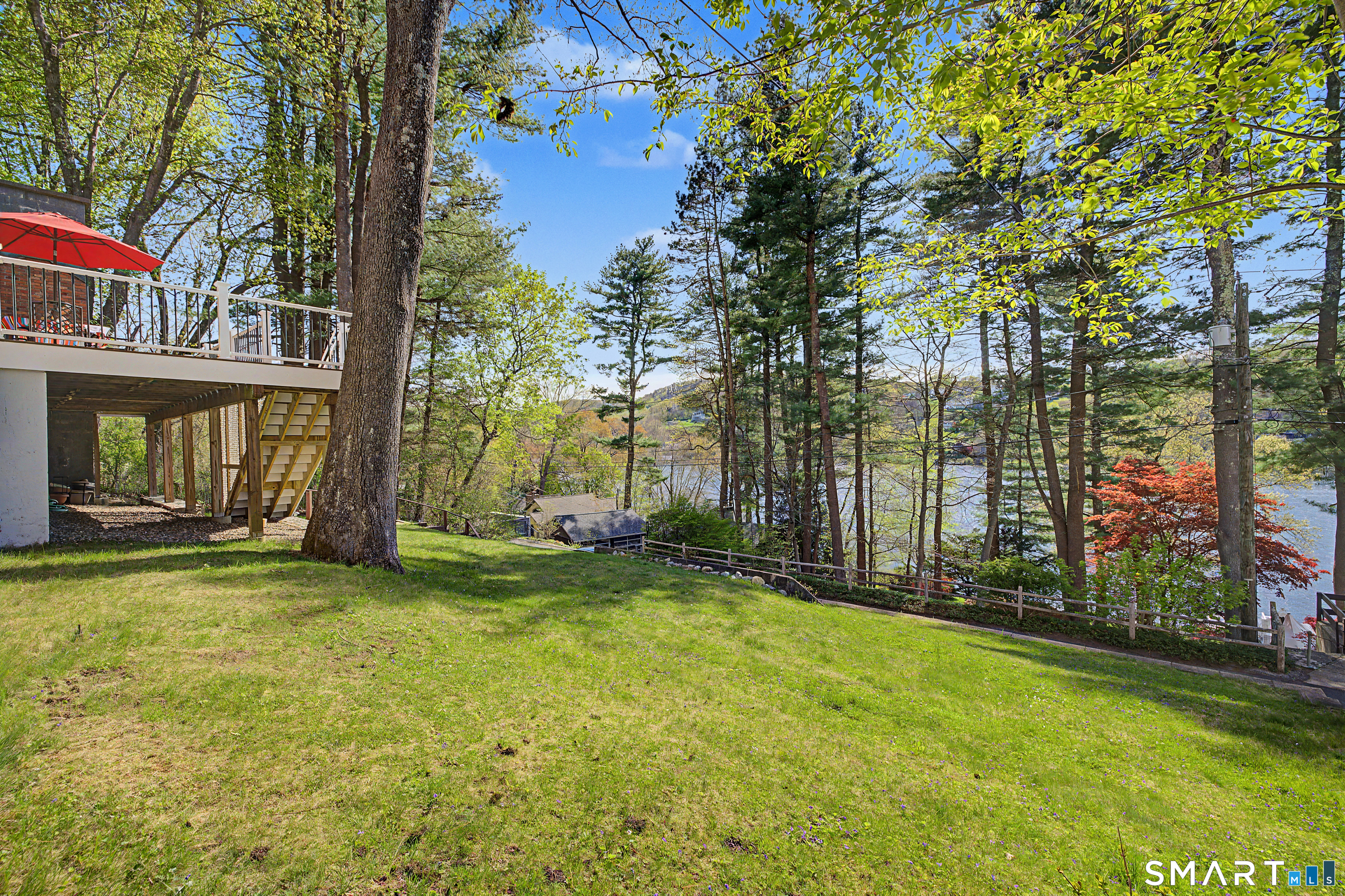 11 Candlewood Springs Road New Milford, CT 06776 - Photo 2 of 35 a view of a yard with large trees and a barn