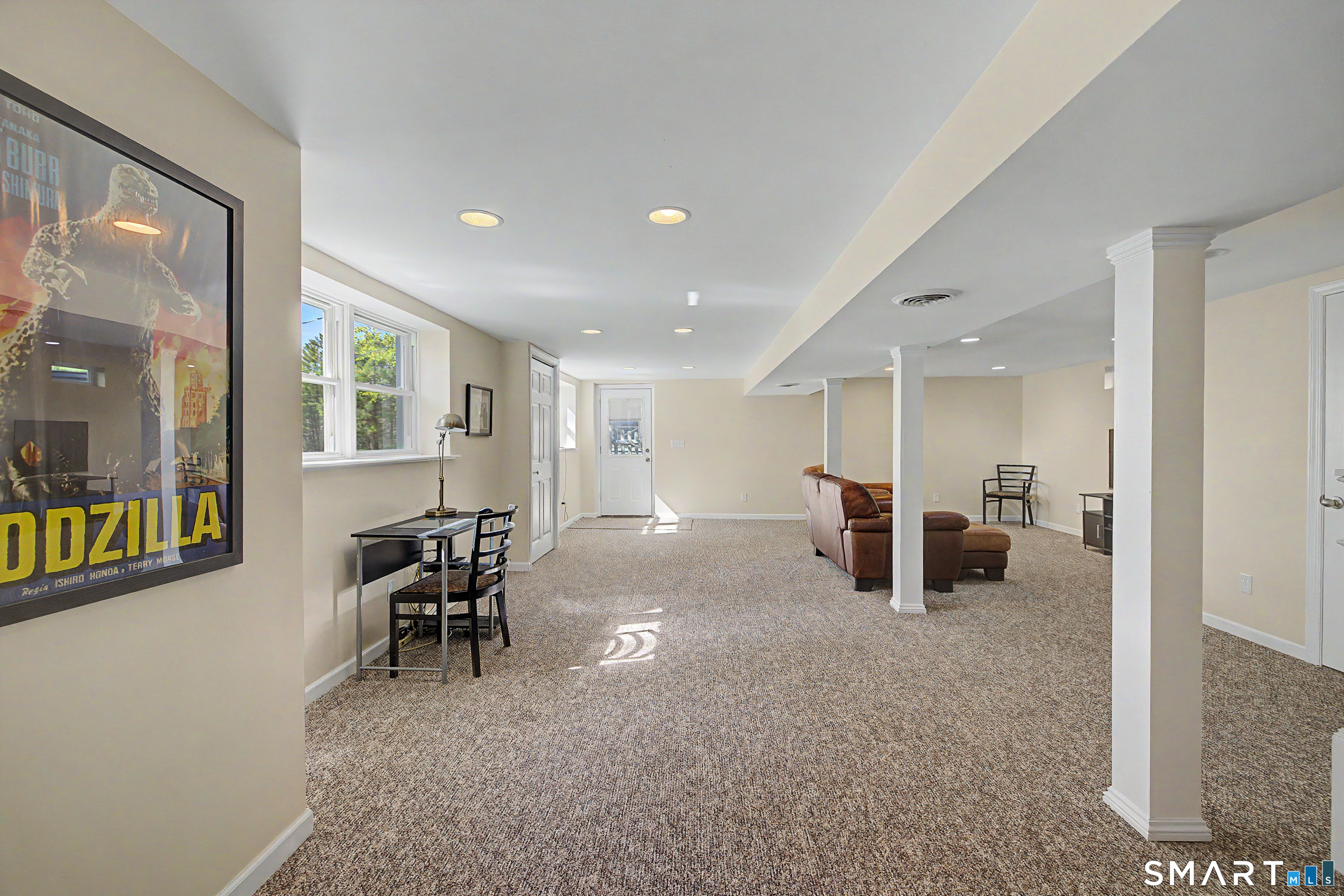 11 Candlewood Springs Road New Milford, CT 06776 - Photo 25 of 35 a living room with furniture and a table