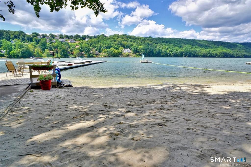 11 Candlewood Springs Road New Milford, CT 06776 - Photo 5 of 35 a view of a lake with beach and outdoor seating
