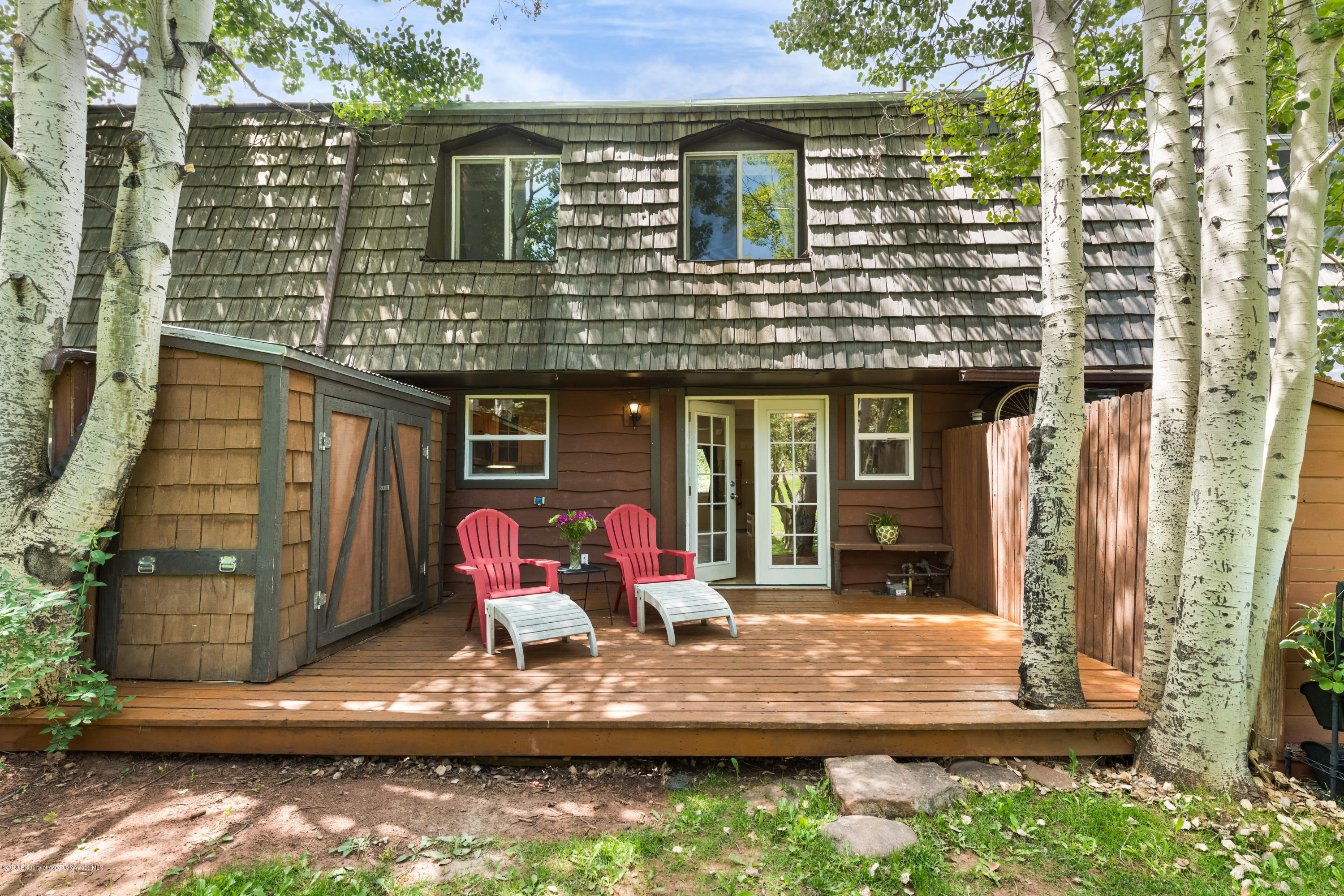 a house view with pool table and chairs