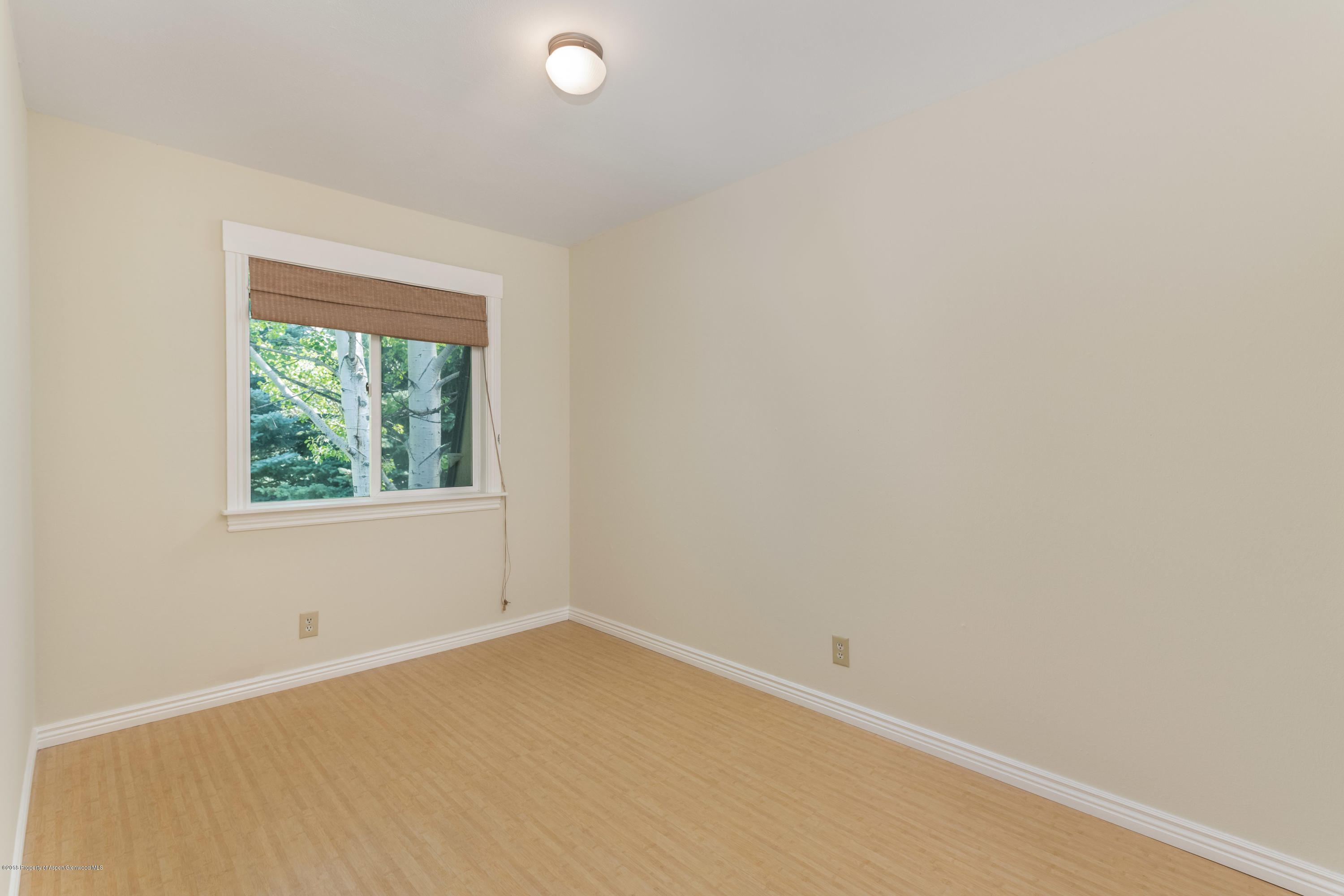 331 Holland Hills Road, Unit 6 Basalt, CO 81621 - Photo 12 of 27 an empty room with a window