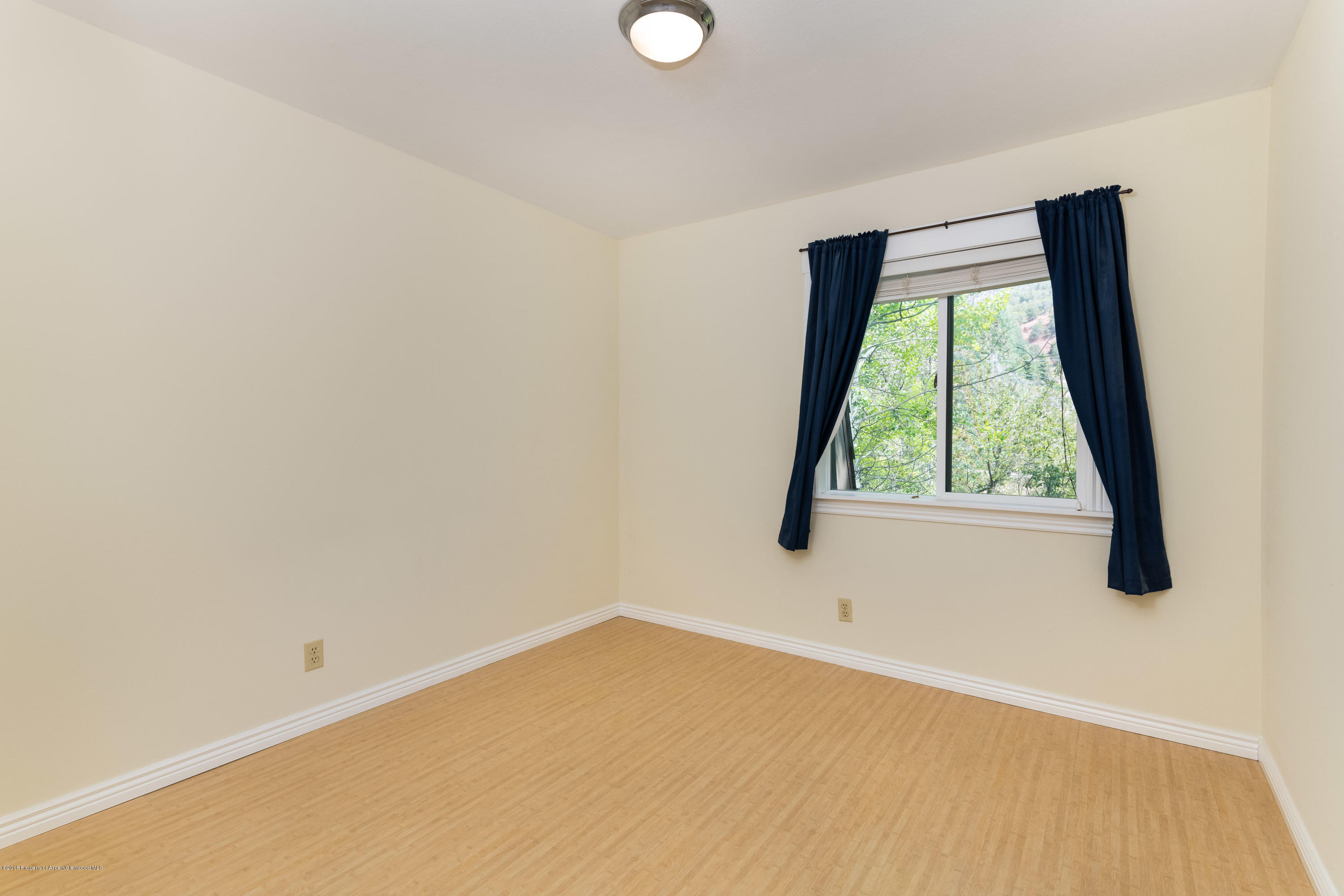 331 Holland Hills Road, Unit 6 Basalt, CO 81621 - Photo 13 of 27 an empty room with a window