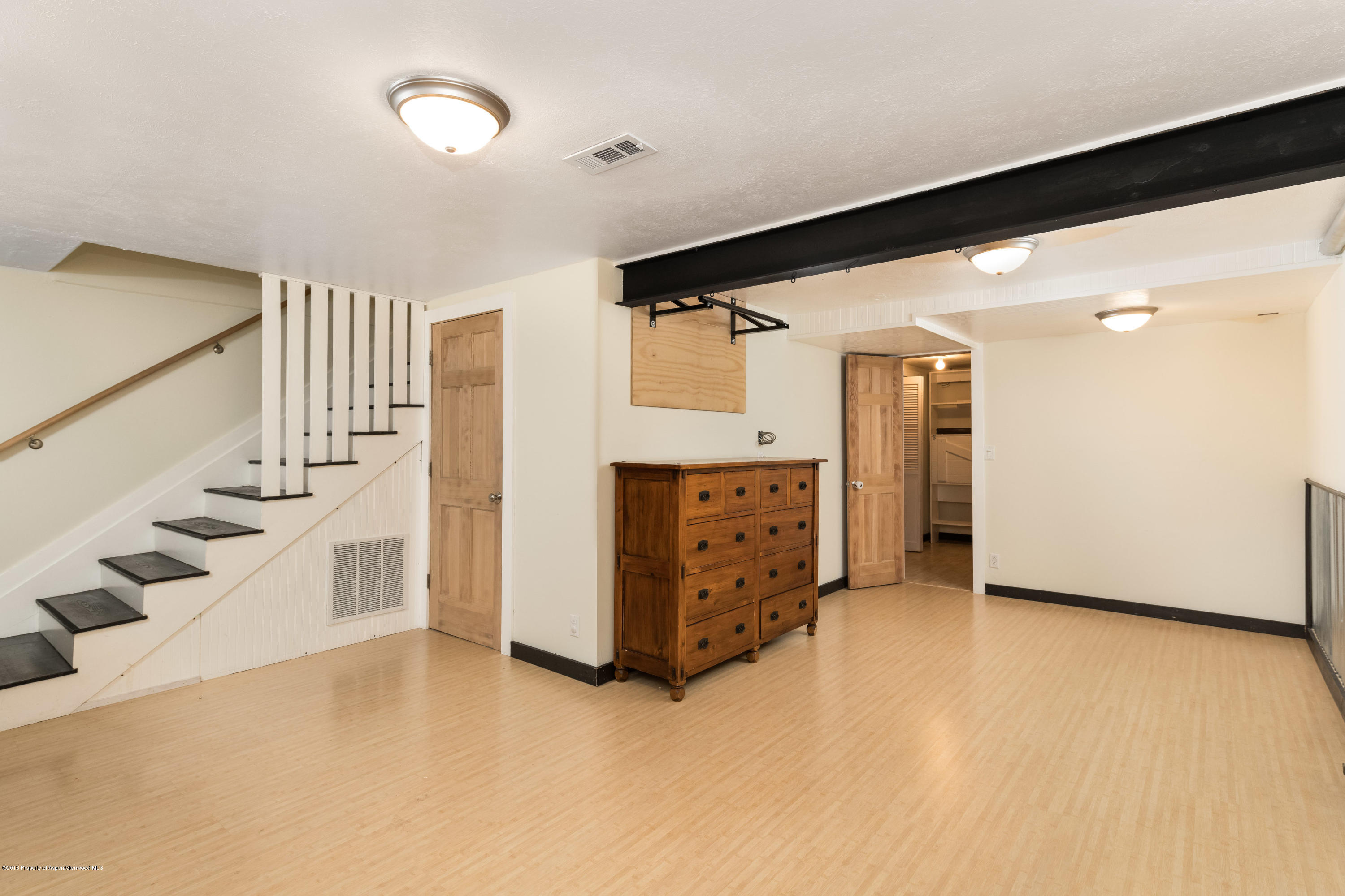 331 Holland Hills Road, Unit 6 Basalt, CO 81621 - Photo 15 of 27 a view of an empty room and a kitchen