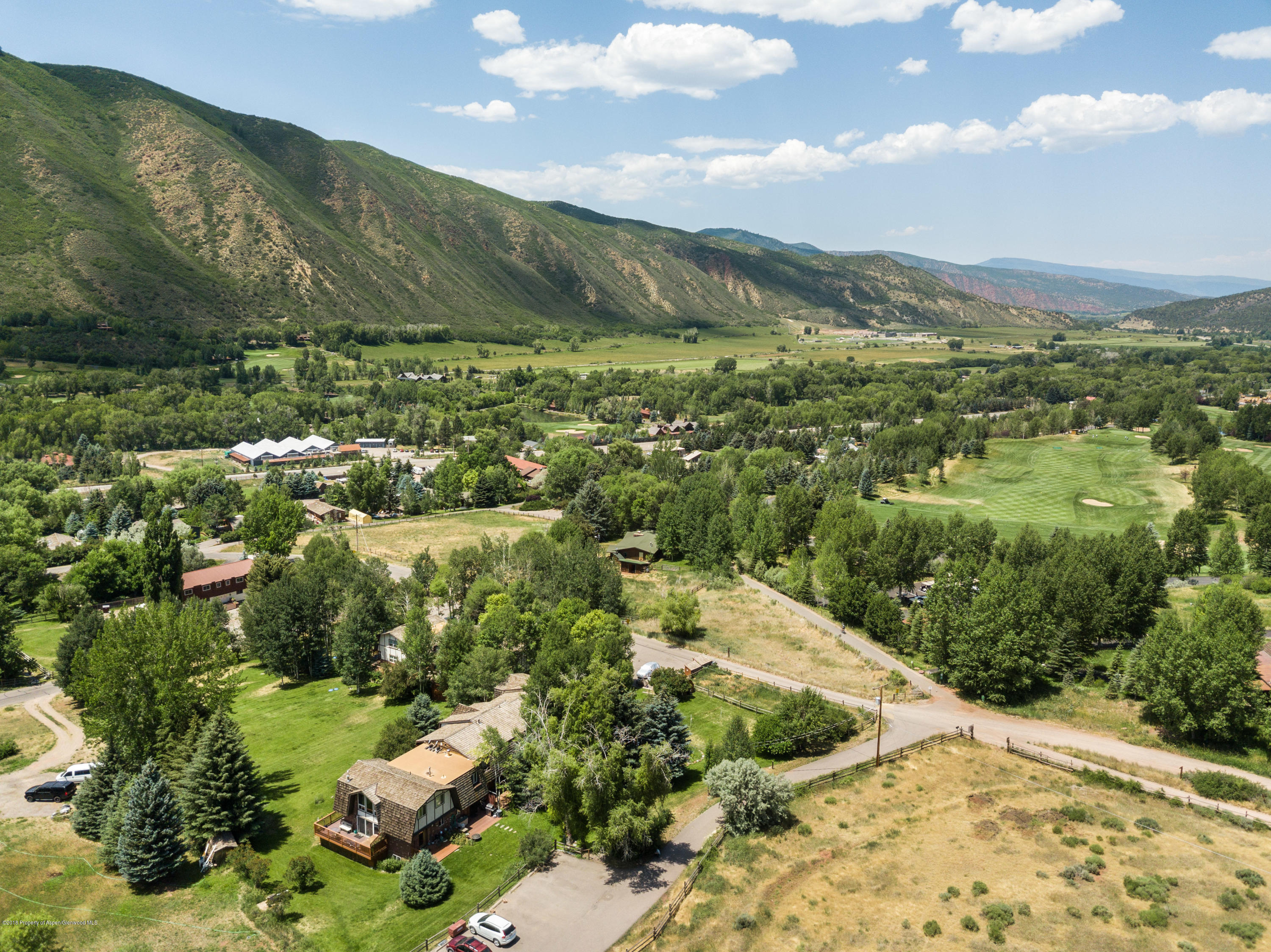 331 Holland Hills Road, Unit 6 Basalt, CO 81621 - Photo 25 of 27 a view of a yard with mountains