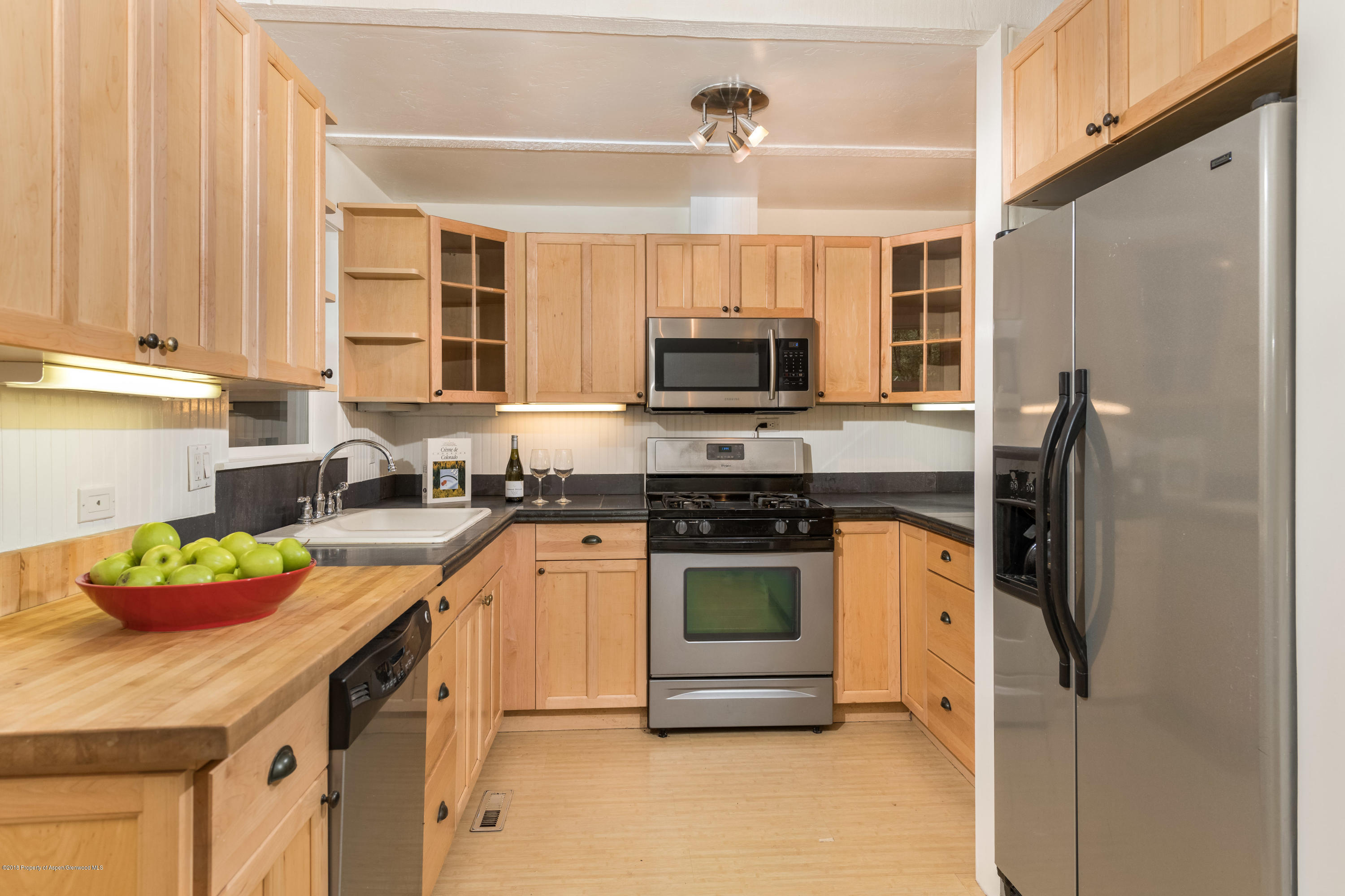 331 Holland Hills Road, Unit 6 Basalt, CO 81621 - Photo 5 of 27 a kitchen with stainless steel appliances granite countertop a sink a stove and a refrigerator