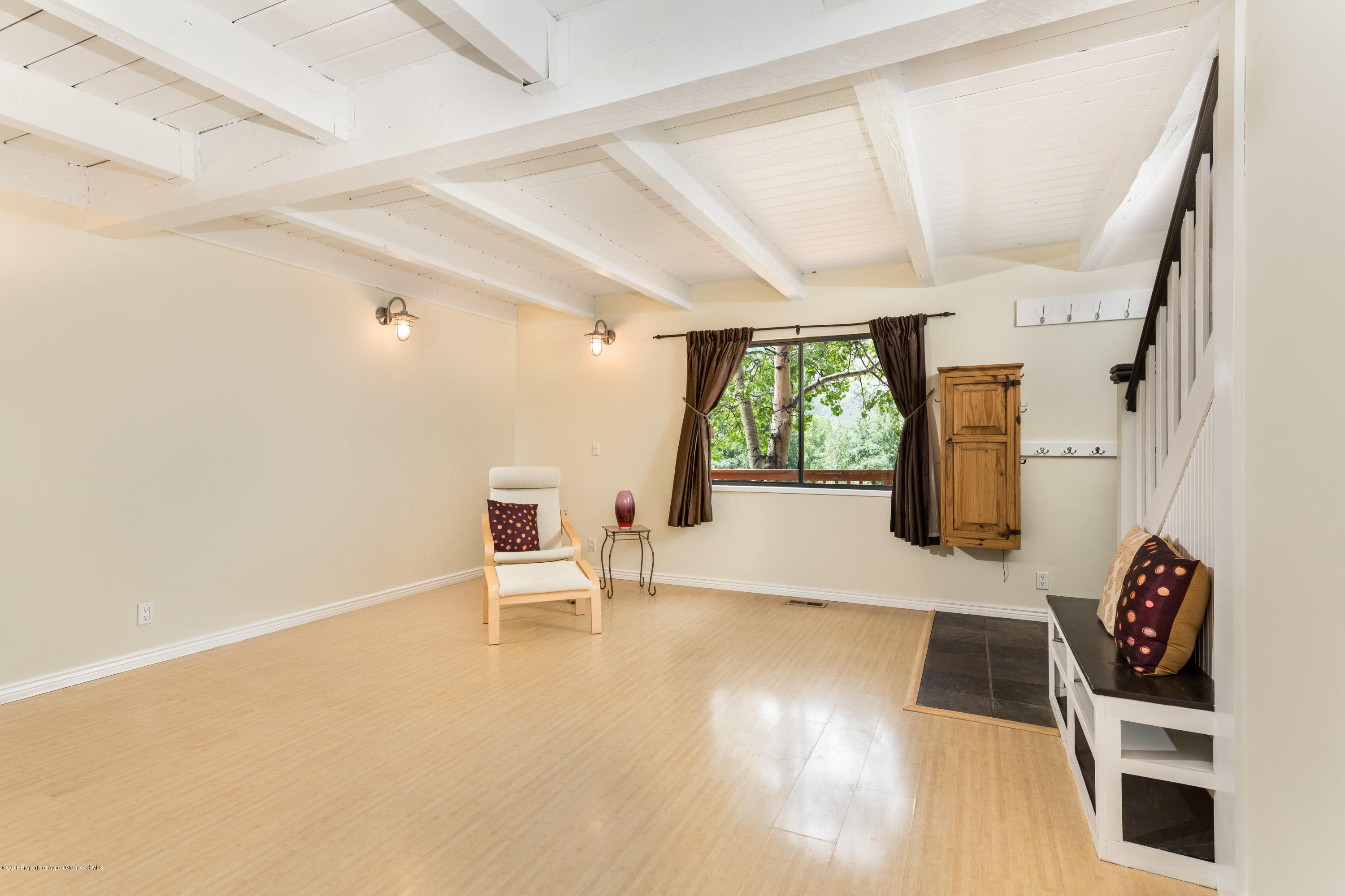331 Holland Hills Road, Unit 6 Basalt, CO 81621 - Photo 7 of 27 a living room with furniture and a large window