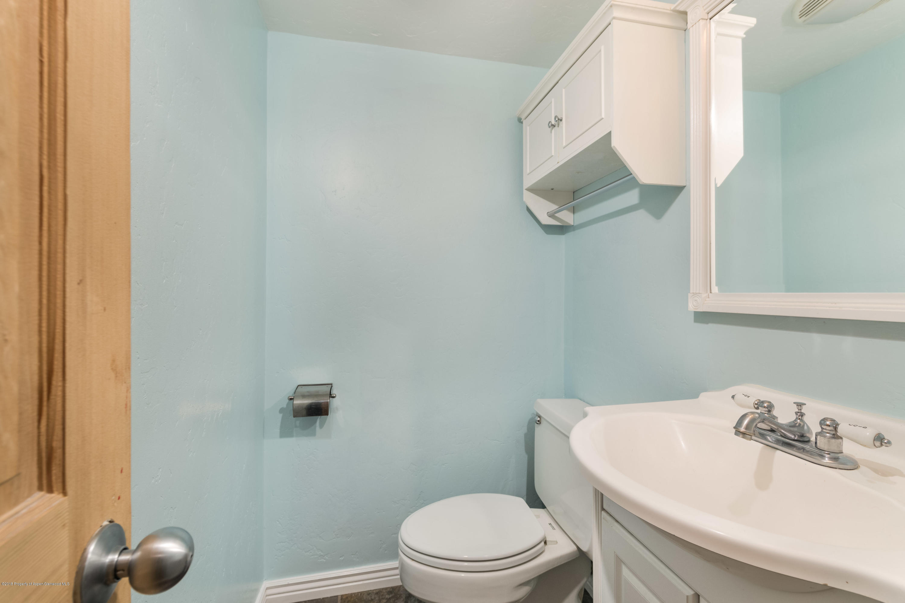 331 Holland Hills Road, Unit 6 Basalt, CO 81621 - Photo 9 of 27 a bathroom with a sink mirror and toilet