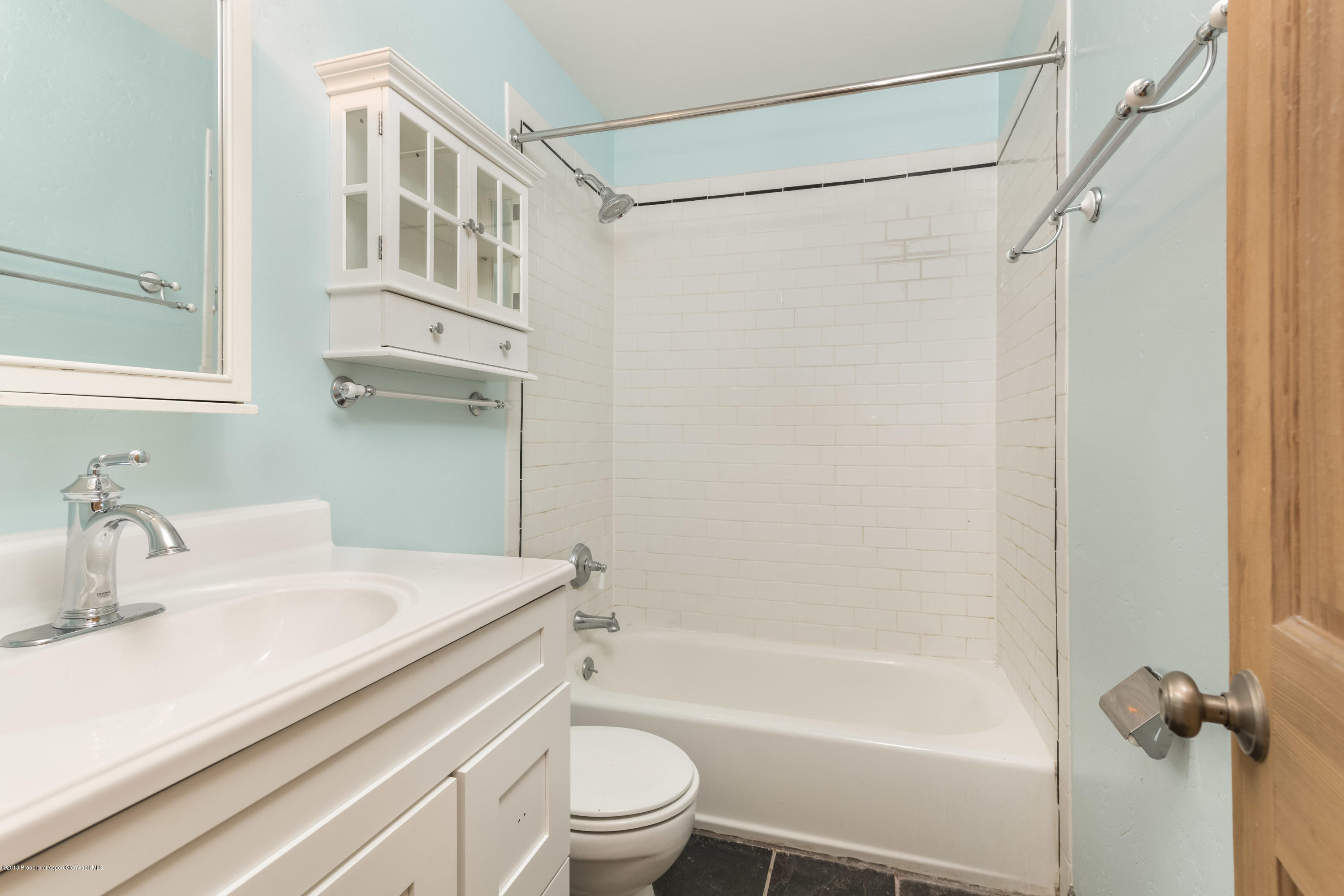 331 Holland Hills Road, Unit 6 Basalt, CO 81621 - Photo 10 of 27 a bathroom with a sink a mirror toilet and bathtub