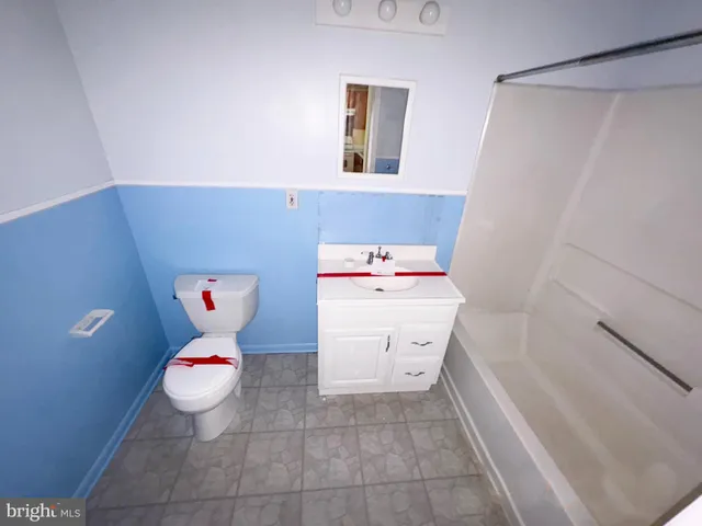 a view of a house with a yard and a large window