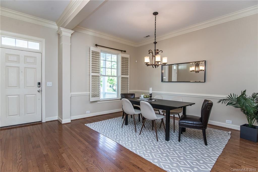 944 Gardenia Street Fort Mill, SC 29708 - Photo 11 of 35 a view of a dining room with furniture window and wooden floor
