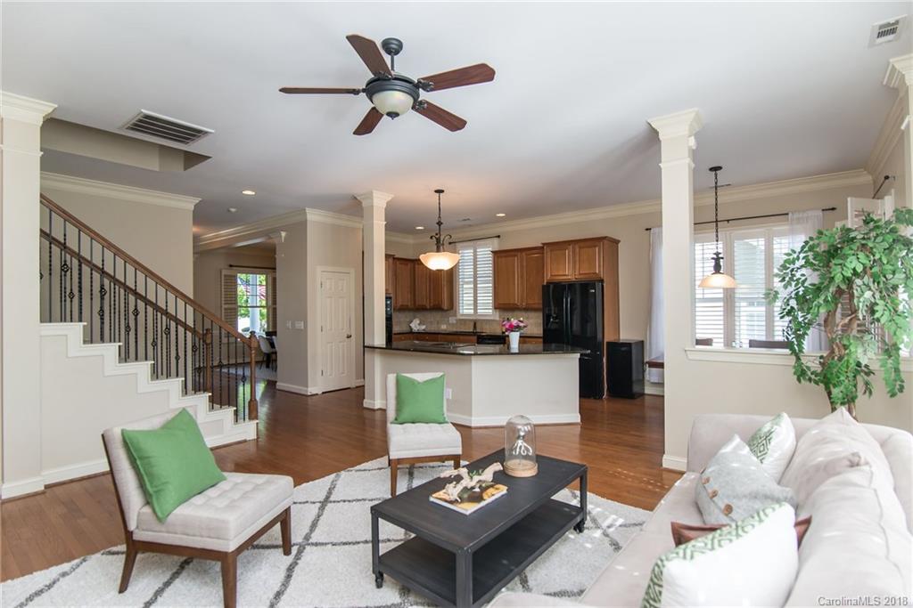 944 Gardenia Street Fort Mill, SC 29708 - Photo 15 of 35 a living room with furniture kitchen view and a chandelier