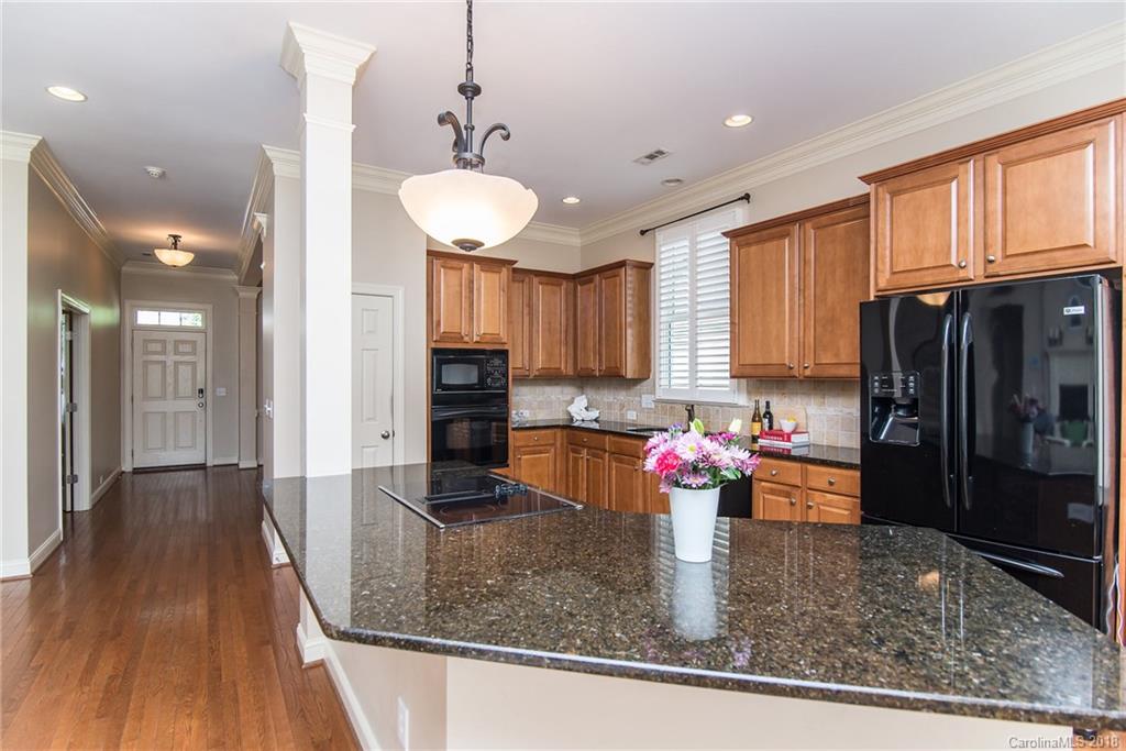 944 Gardenia Street Fort Mill, SC 29708 - Photo 18 of 35 a kitchen with stainless steel appliances granite countertop a refrigerator and a sink