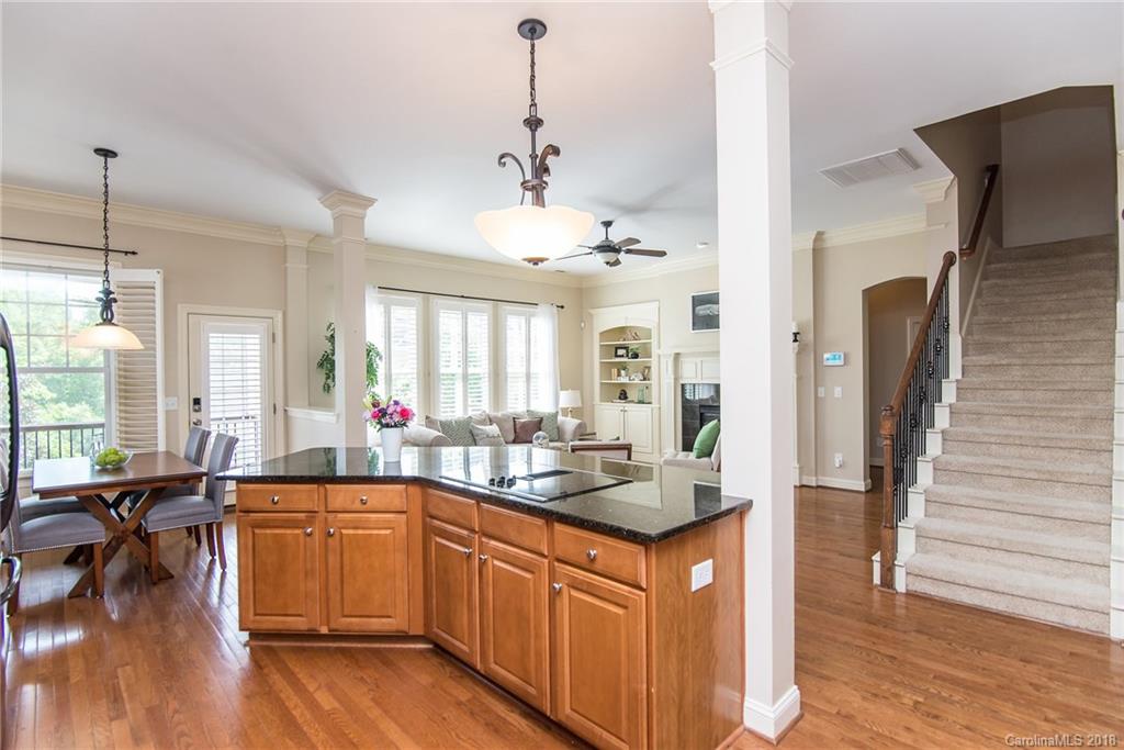 944 Gardenia Street Fort Mill, SC 29708 - Photo 20 of 35 a kitchen with lots of counter top space and living room