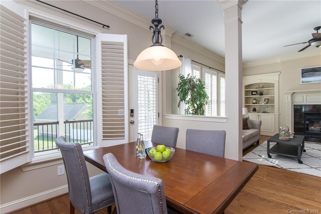 944 Gardenia Street Fort Mill, SC 29708 - Photo 21 of 35 a view of a dining room with furniture window and wooden floor