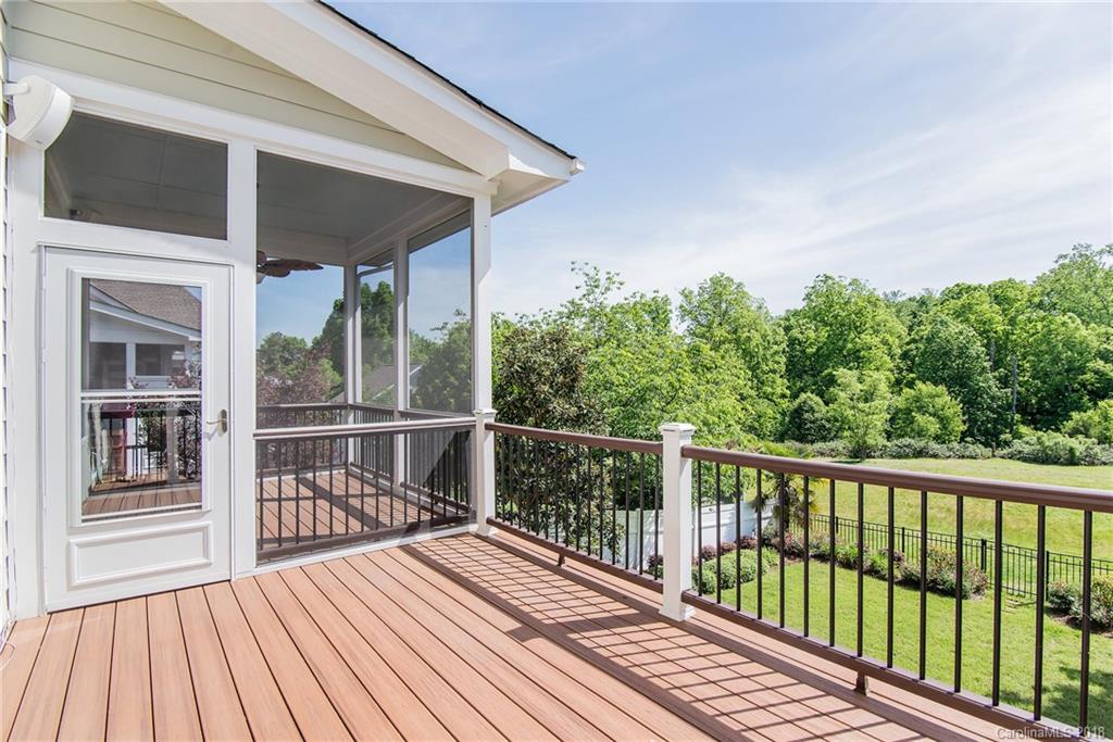 944 Gardenia Street Fort Mill, SC 29708 - Photo 9 of 35 a view of a wooden deck with a yard