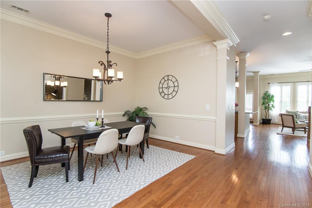944 Gardenia Street Fort Mill, SC 29708 - Photo 10 of 35 a view of a dining room with furniture and wooden floor