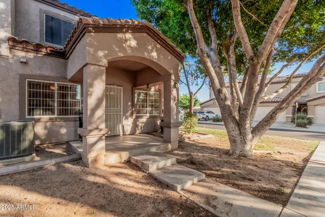 a view of a house with a tree