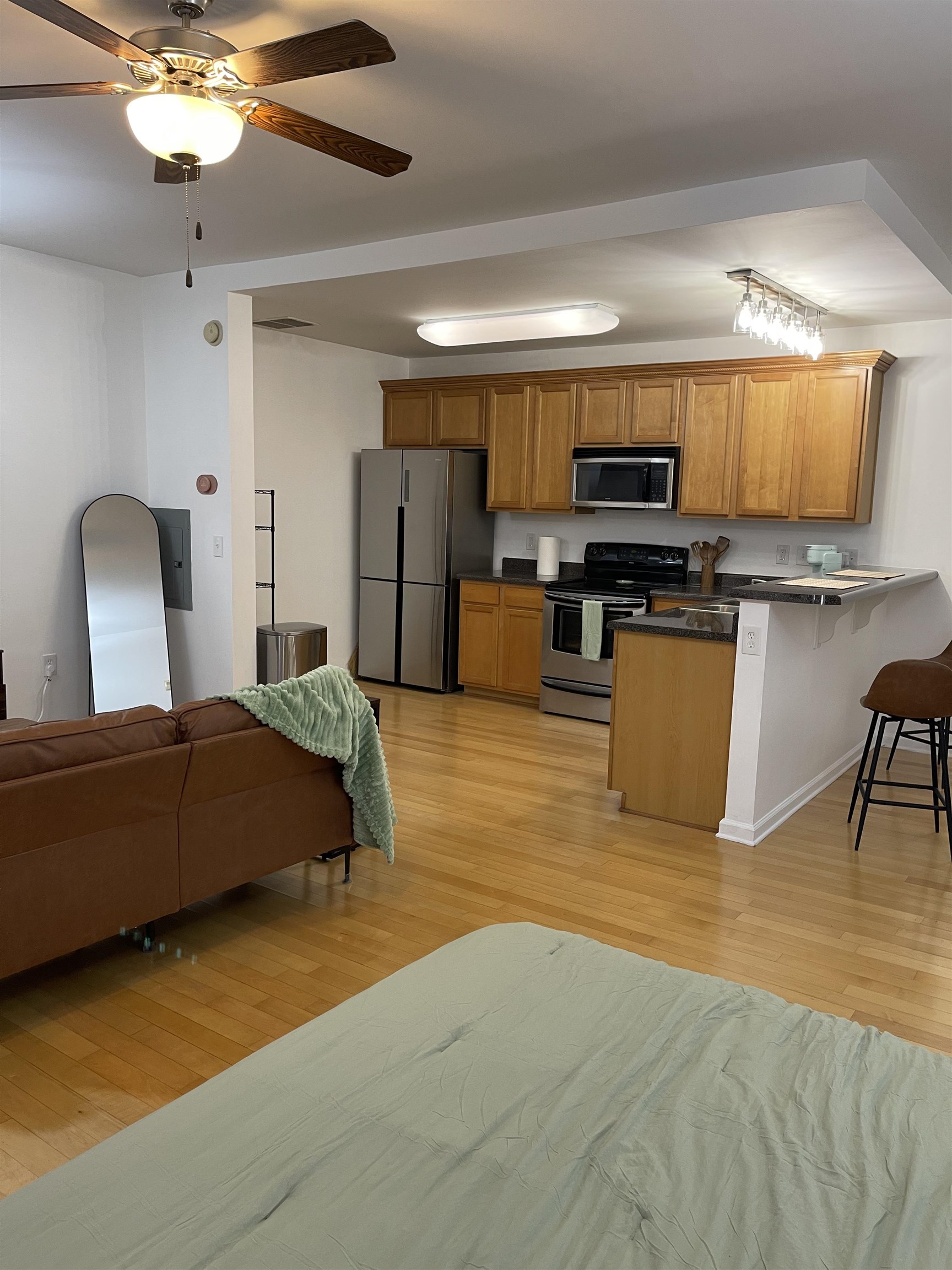 731 Litty Court, Unit 305 Memphis, TN 38103 - Photo 11 of 15 a living room with furniture kitchen view and a flat screen tv