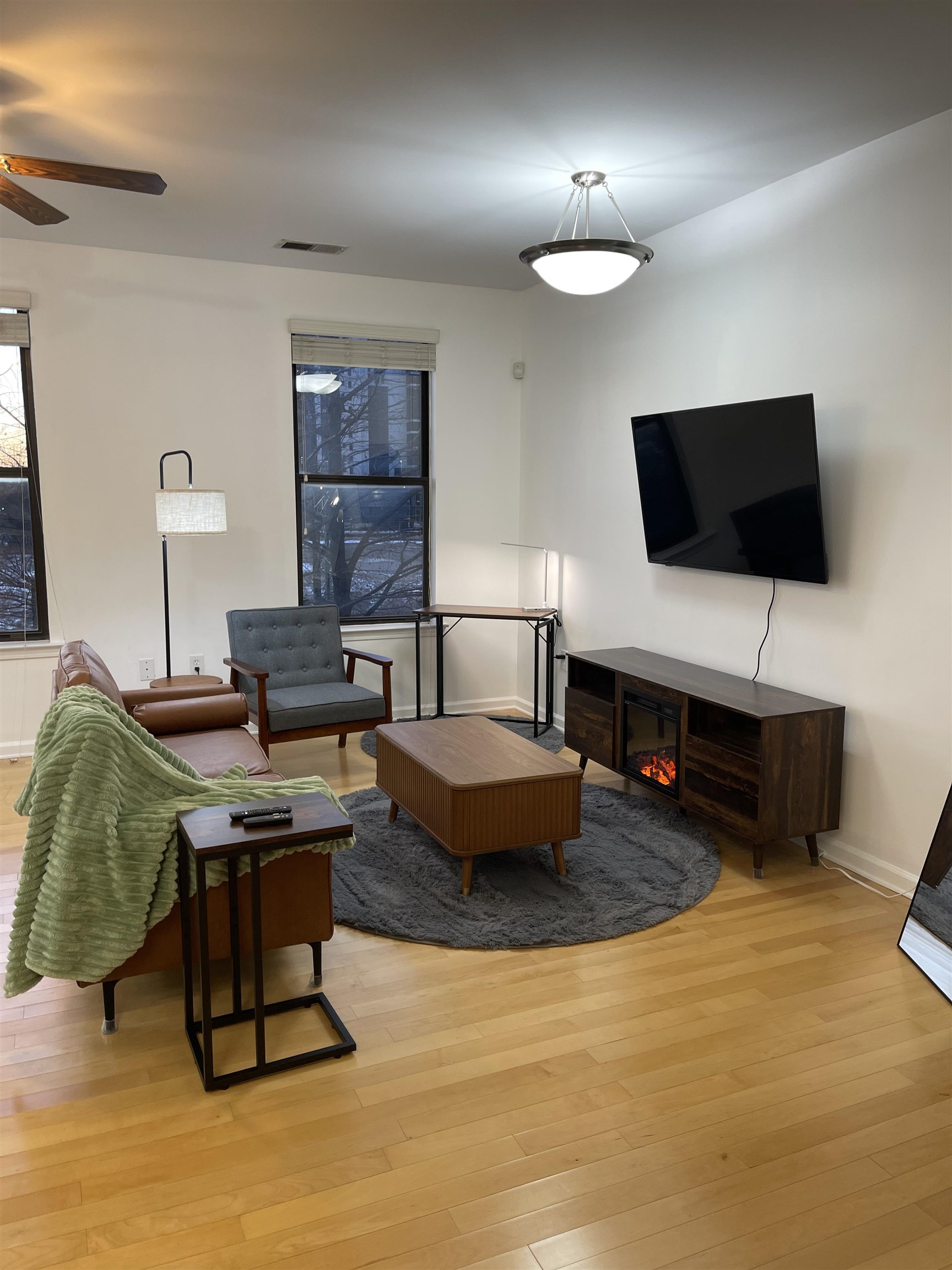 731 Litty Court, Unit 305 Memphis, TN 38103 - Photo 2 of 15 a living room with furniture and a flat screen tv