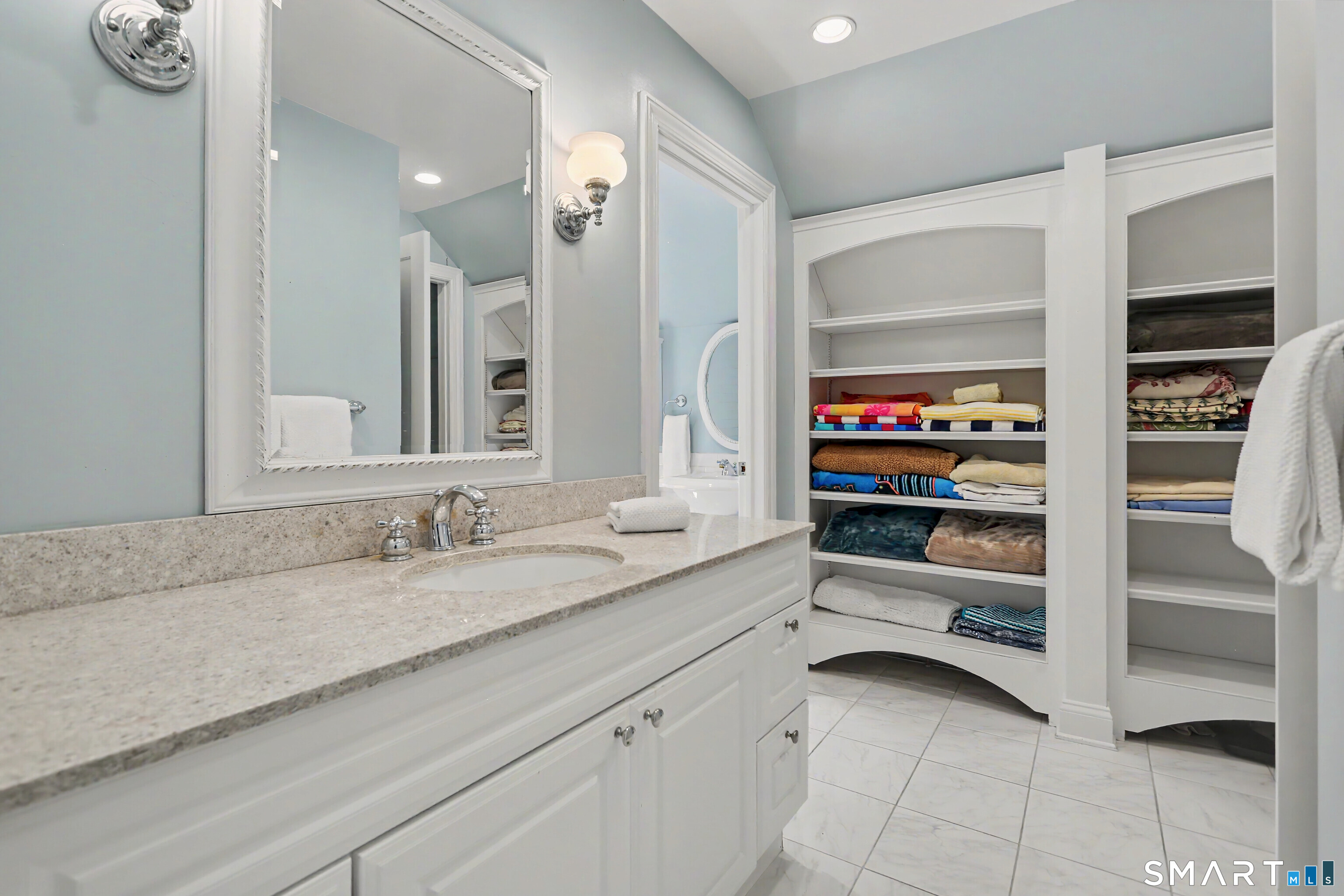 31 Vista Road Wilton, CT 06897 - Photo 26 of 34 Ideal for sharing, this well-planned bathroom offers a private vanity space separate from the shower and WC for added convenience.