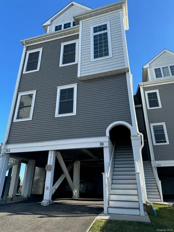 a front view of a house with stairs
