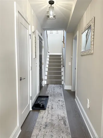 a view of gallery with wooden floor