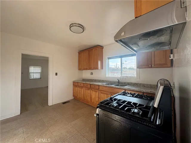 a kitchen with a stove and a cabinet