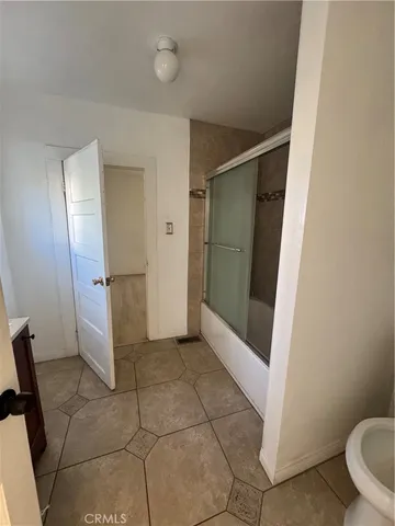 a bathroom with a shower and toilet