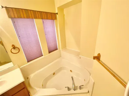 a bathroom with a bathtub and shower