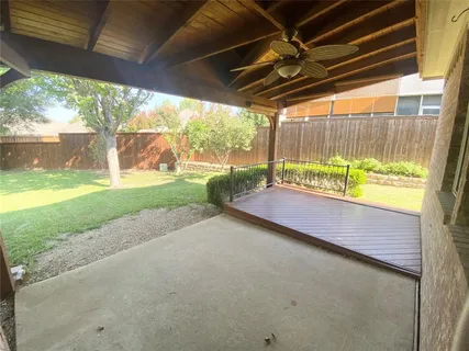 a view of backyard with green space