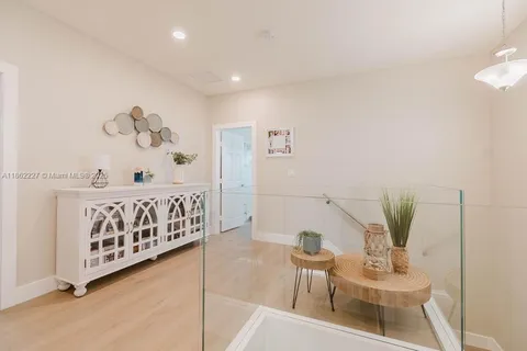 a bedroom with furniture and wooden floor