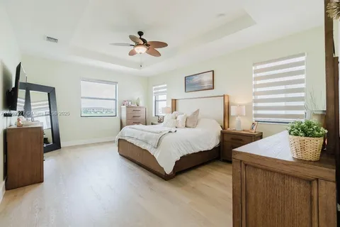 a bedroom with bed and window