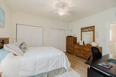 a bedroom with a bed and furniture